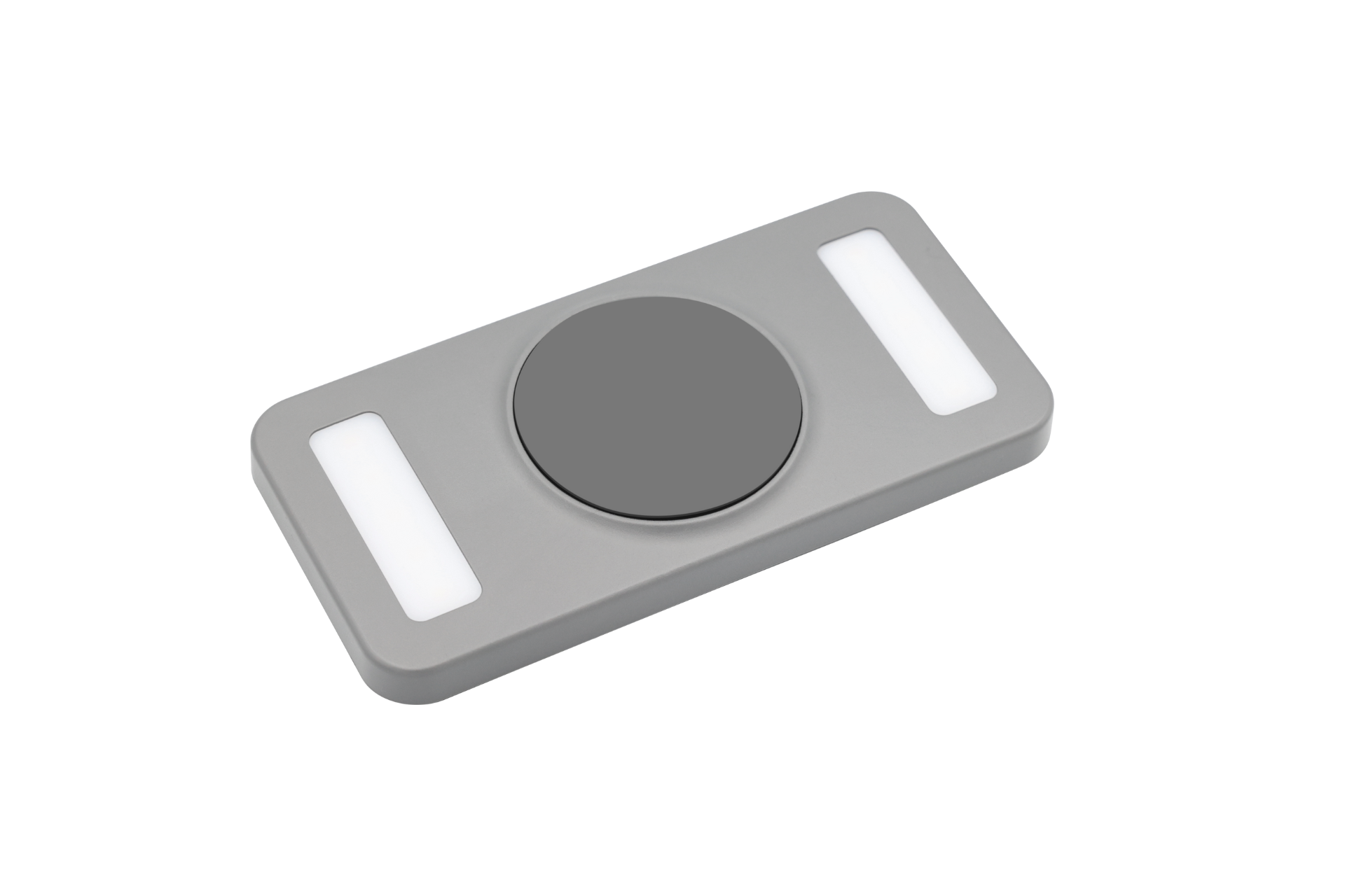 JOWUA 台灣便攜式 LED 燈(支援 MagSafe 無線充電)是一款灰色矩形設備,帶有一個中央圓形按鈕,兩側是兩個細長的白色面板,可能包括弧形開關技術,以增強無縫設計。.